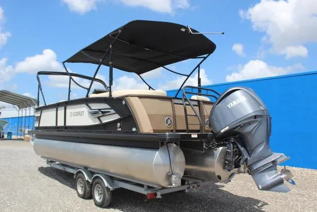 Slide: The Image of 2023 Godfrey AquaPatio 255 SBC pontoon boat, side view, sleek design, modern features. - 4