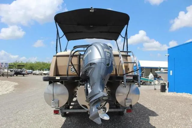 Slide: The Image of 2023 Godfrey AquaPatio 255 SBC pontoon boat with Yamaha engine on trailer. - 6