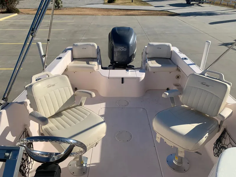 Slide: The Image of 2009 Grady-White Tournament 205 boat interior with seating and outboard motor. - 10