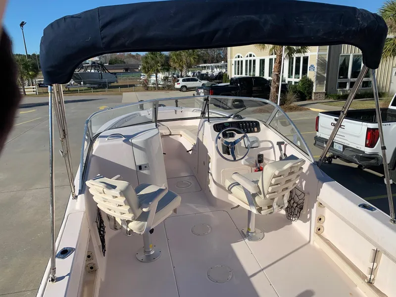 Slide: The Image of 2009 Grady-White Tournament 205 boat with dual seats and canopy. - 11