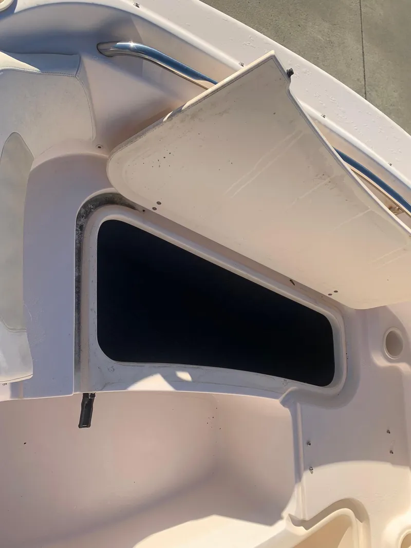 Slide: The Image of Open storage compartment on a 2009 Grady-White Tournament 205 boat. - 17