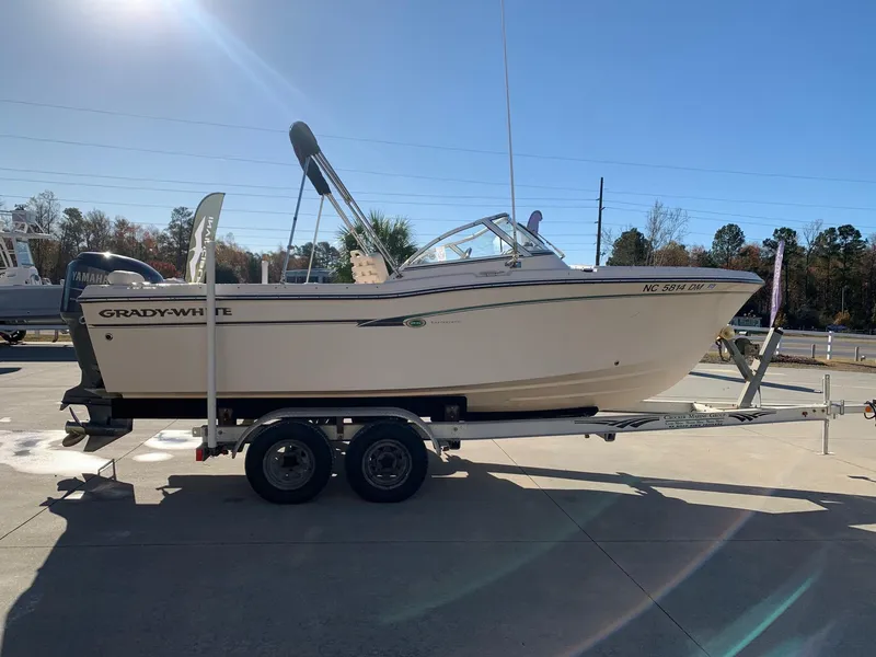 Slide: The Image of 2009 Grady-White Tournament 205 boat on trailer in outdoor setting. - 2
