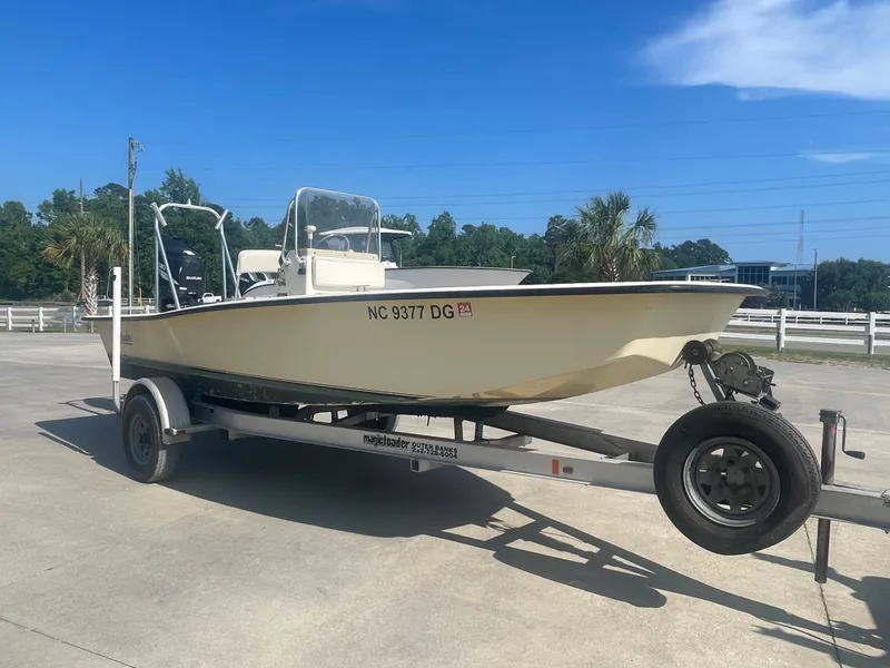 Slide: The Image of 2006 Intruder Pro Marine 20 boat on a trailer in a parking lot. - 3
