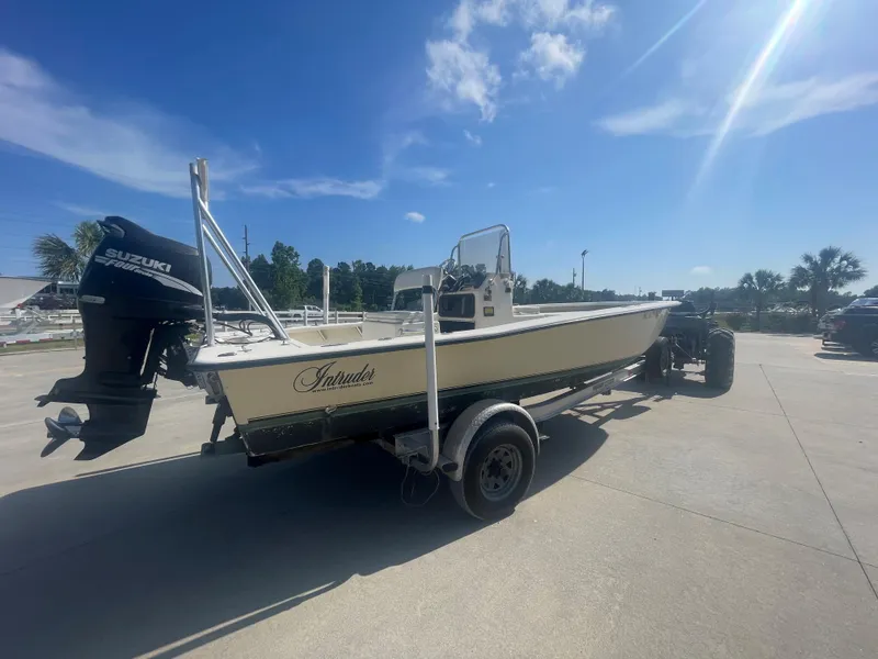Slide: The Image of 2006 Intruder Pro Marine 20 boat on trailer with Suzuki outboard motor. - 2
