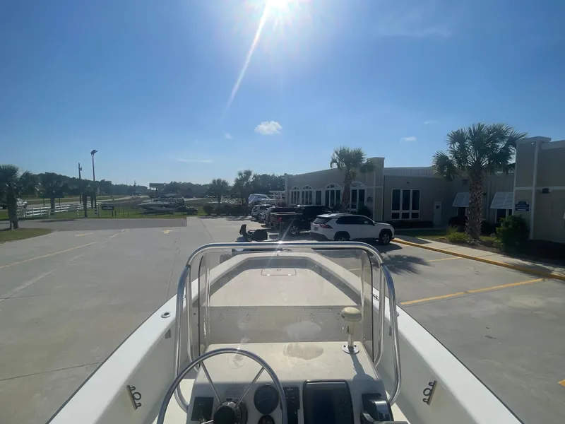 Slide: The Image of 2006 Intruder Pro Marine 20 boat parked in a sunny lot. - 5
