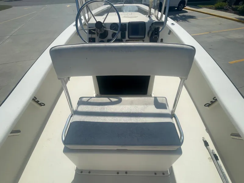 Slide: The Image of 2006 Intruder Pro Marine 20 boat interior with steering wheel and seating. - 10