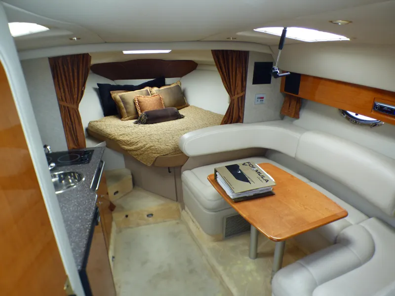 Slide: The Image of Interior of a 2004 Formula 31 Performance Cruiser with bed and seating area. - 10