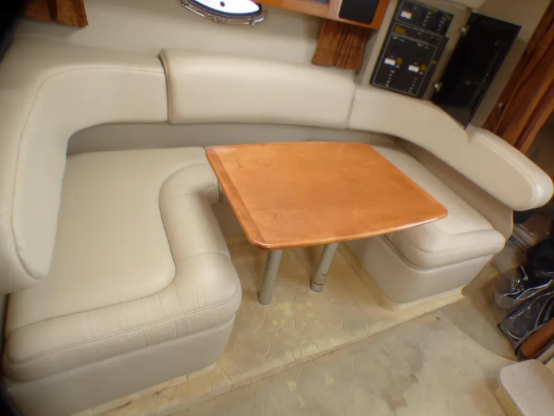 Slide: The Image of Interior of a 2004 Formula 31 Performance Cruiser with leather sofa and wooden table. - 13
