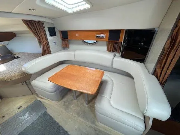 Slide: The Image of Interior of 2004 Formula 31 Performance Cruiser with leather sofa and wooden table. - 15