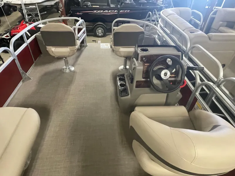 Slide: The Image of 2023 Sun Tracker Bass Buggy 18 DLX pontoon boat interior with steering console and seating. - 11