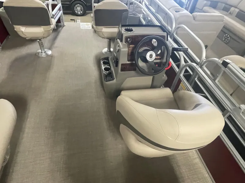 Slide: The Image of 2023 Sun Tracker Bass Buggy 18 DLX interior with helm and seating. - 12