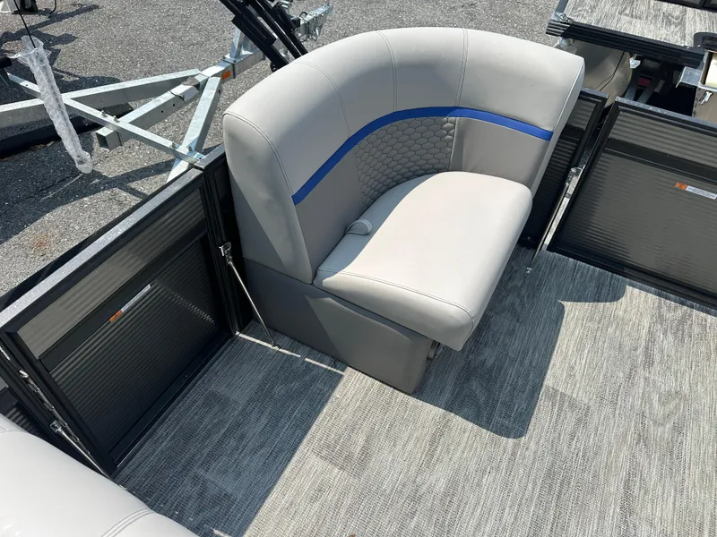 Slide: The Image of 2023 Qwest 818 Lanai LT boat seating with gray upholstery and blue accent. - 11
