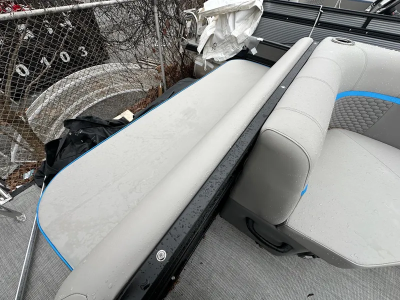 Slide: The Image of 2023 Qwest 818 Lanai LT boat interior with gray and blue seating. - 14