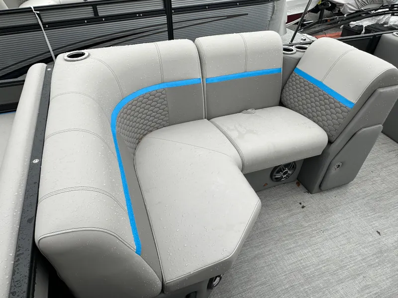 Slide: The Image of 2023 Qwest 818 Lanai LT boat seating with gray upholstery and blue accents. - 16