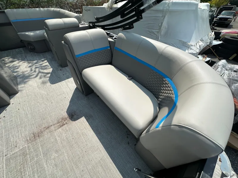 Slide: The Image of 2023 Qwest 818 Lanai LT boat interior with gray and blue seating. - 3