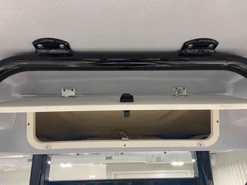 Slide: The Image of Storage compartment on the 2024 Robalo 246 Cayman boat. - 14