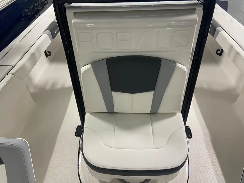 Slide: The Image of 2024 Robalo 246 Cayman boat seat with white and gray upholstery. - 15