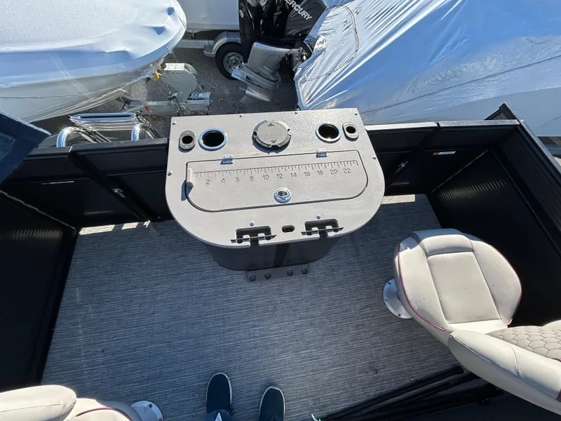 Slide: The Image of 2023 Qwest 818 XRE Cruise boat deck with control panel and seating. - 3