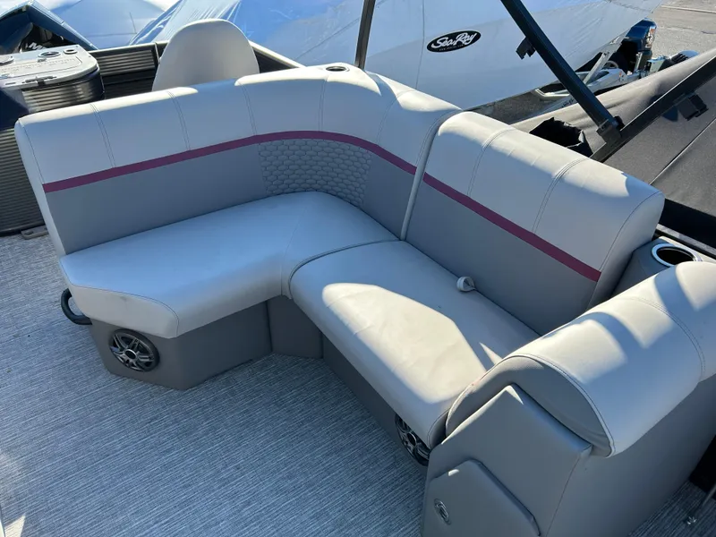 Slide: The Image of 2023 Qwest 818 XRE Cruise boat interior with gray seating and maroon accents. - 6