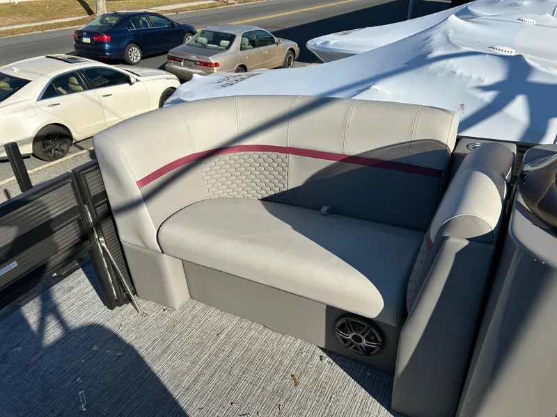 Slide: The Image of 2023 Qwest 818 XRE Cruise boat seat with gray upholstery and speaker. - 8