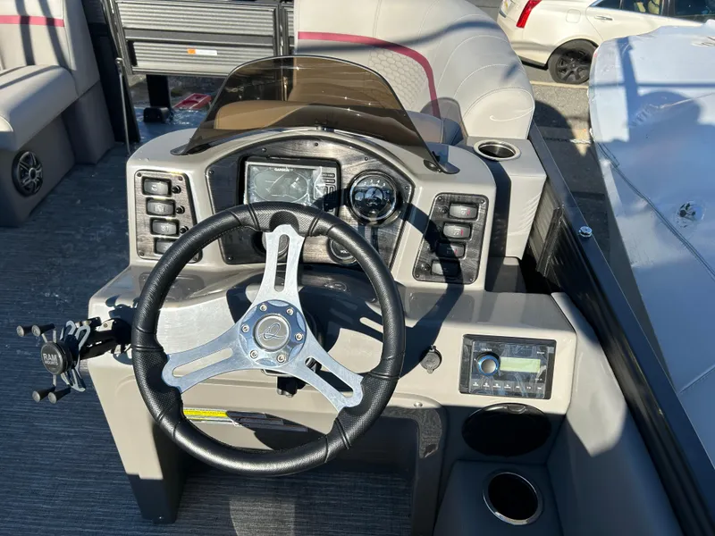 Slide: The Image of 2023 Qwest 818 XRE Cruise boat dashboard with steering wheel and control panel. - 9