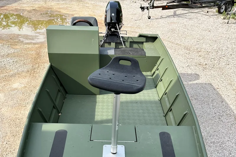 The Image of 2022 Jon Boat Aluminum Boat with motor and elevated seat on gravel. - 1