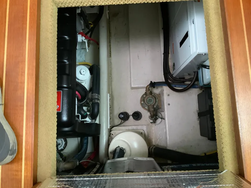 Slide: The Image of Engine compartment of a 2010 Nordic Tug 32 boat, showcasing mechanical components. - 42