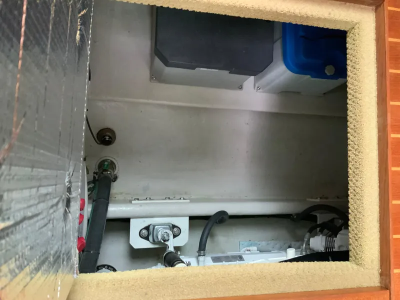 Slide: The Image of Engine compartment of a 2010 Nordic Tug 32, showing mechanical components and wiring. - 44