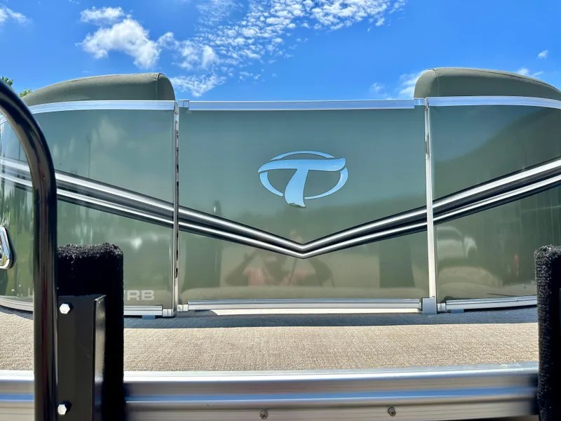 Slide: The Image of 2023 Tahoe Pontoon LTZ Cruise 25 FT Triple 25 WG, front view under blue sky. - 2