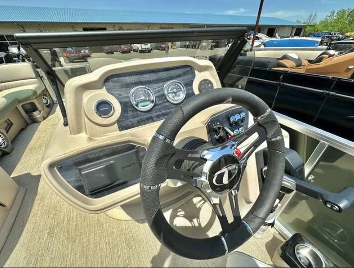 Slide: The Image of 2023 Tahoe Pontoon LTZ Cruise 25 FT Triple 25 WG steering console and dashboard. - 3