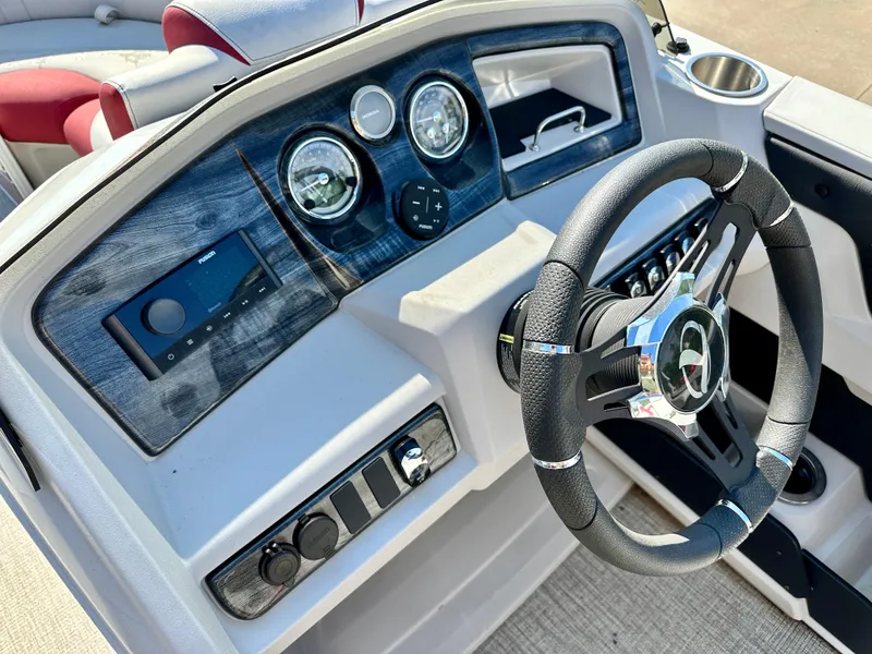 Slide: The Image of 2023 Tahoe Pontoon LTZ QUAD Lounger 23 FT Triple 25 SP dashboard and steering wheel. - 5