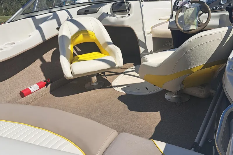 Slide: The Image of Interior of 2006 Tahoe Q-6 boat with yellow and white seating. - 5