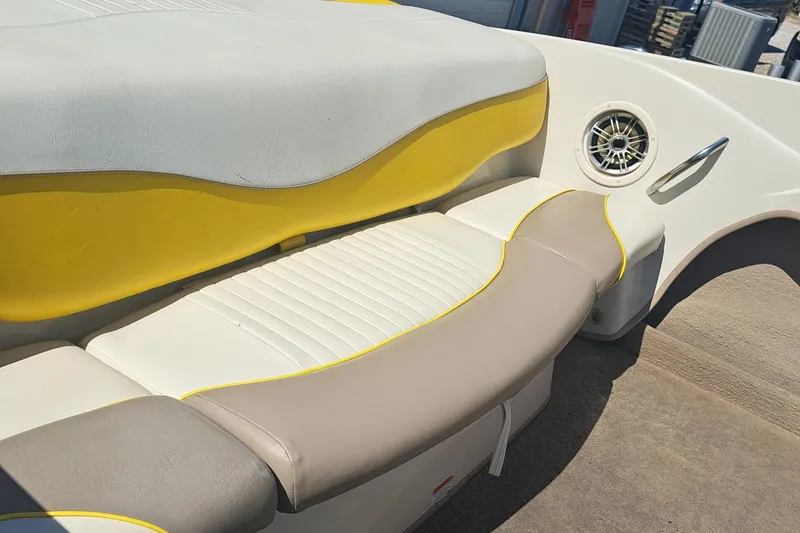 Slide: The Image of 2006 Tahoe Q-6 boat interior with yellow and gray seating. - 6