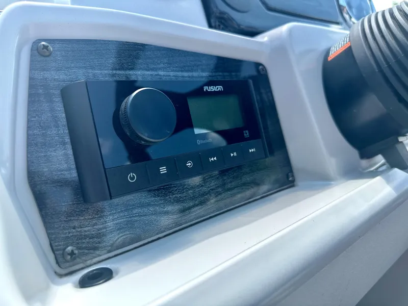 Slide: The Image of Close-up of the 2023 Tahoe Pontoon SLT 1980 GL audio system. - 10