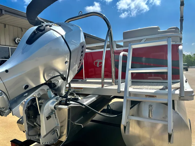 Slide: The Image of 2023 Tahoe Pontoon SLT 1980 GL with outboard motor and ladder. - 18