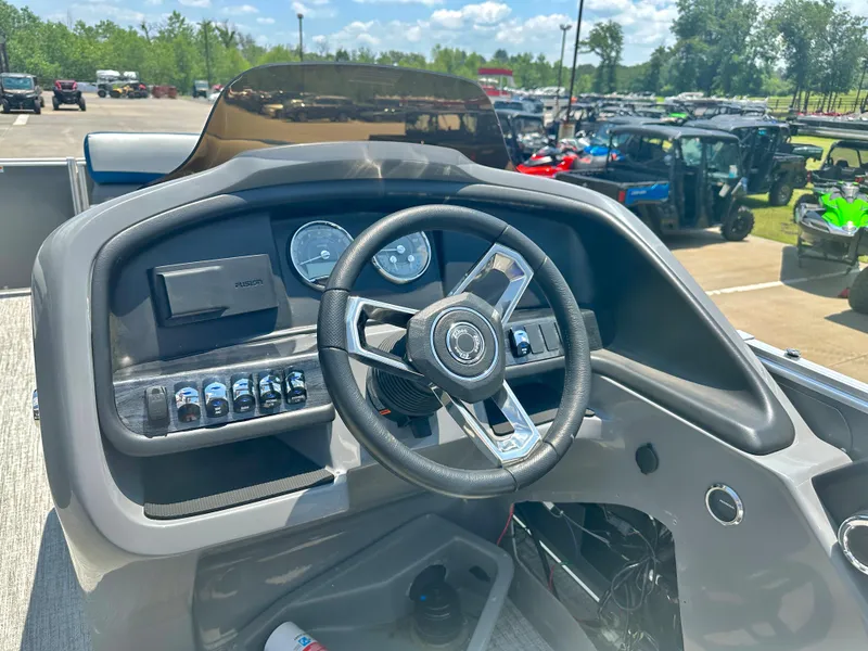Slide: The Image of 2023 Tahoe Pontoon Cascade Cruise 25 FT Triple 25 WG dashboard and steering wheel. - 13