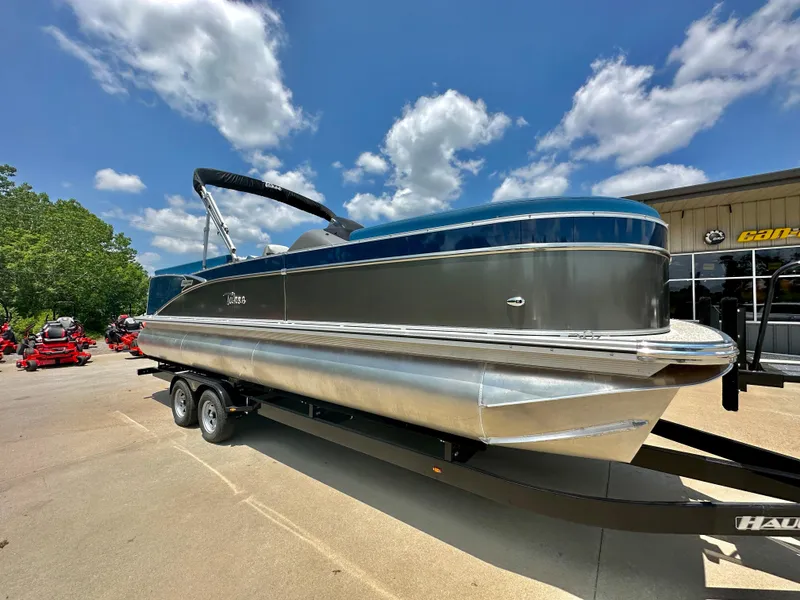 Slide: The Image of 2023 Tahoe Pontoon Cascade Cruise 25 FT Triple 25 WG on trailer under blue sky. - 3