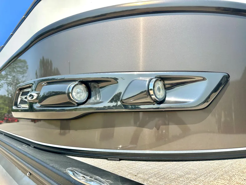 Slide: The Image of 2023 Tahoe Pontoon Cascade Cruise 25 FT Triple 27 WG front detail with chrome accents. - 11