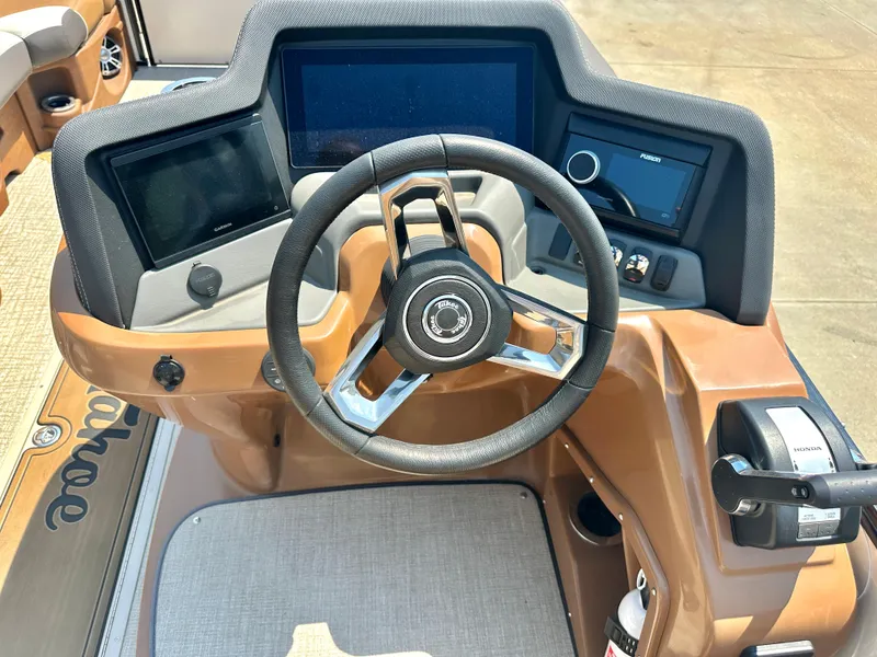 Slide: The Image of 2023 Tahoe Pontoon Cascade Cruise 25 FT Triple 27 WG helm with modern controls and steering wheel. - 13