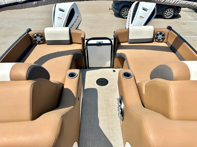 Slide: The Image of 2023 Tahoe Pontoon Cascade Cruise 25 FT Triple 27 WG interior with tan seating and dual engines. - 15