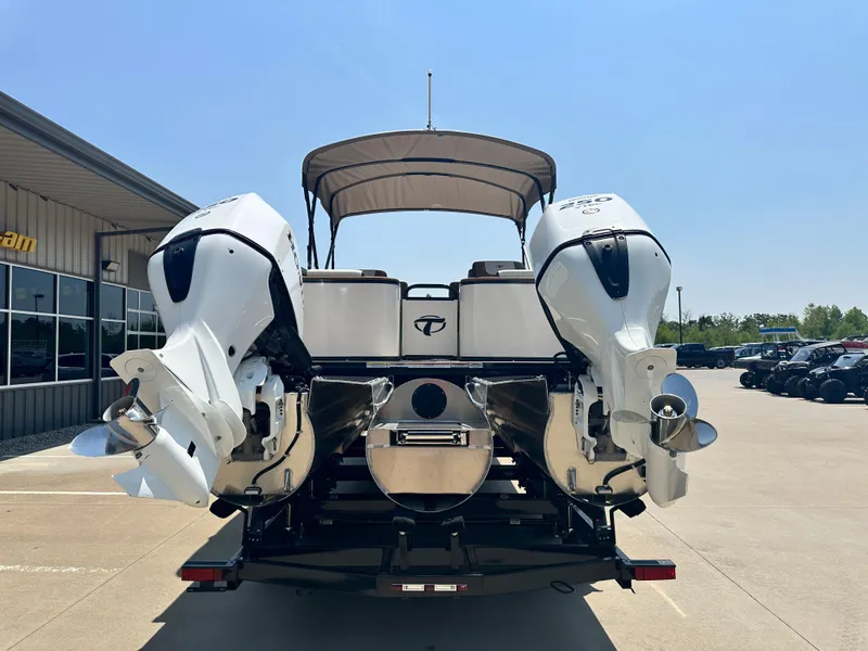 Slide: The Image of 2023 Tahoe Pontoon Cascade Cruise 25 FT Triple 27 WG with dual engines, rear view. - 2