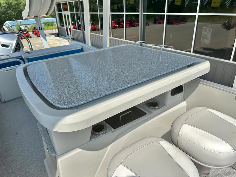 Slide: The Image of 2023 Tahoe Pontoon Cascade Cruise ENT 25 FT Triple 25 WG interior with table and seating. - 12