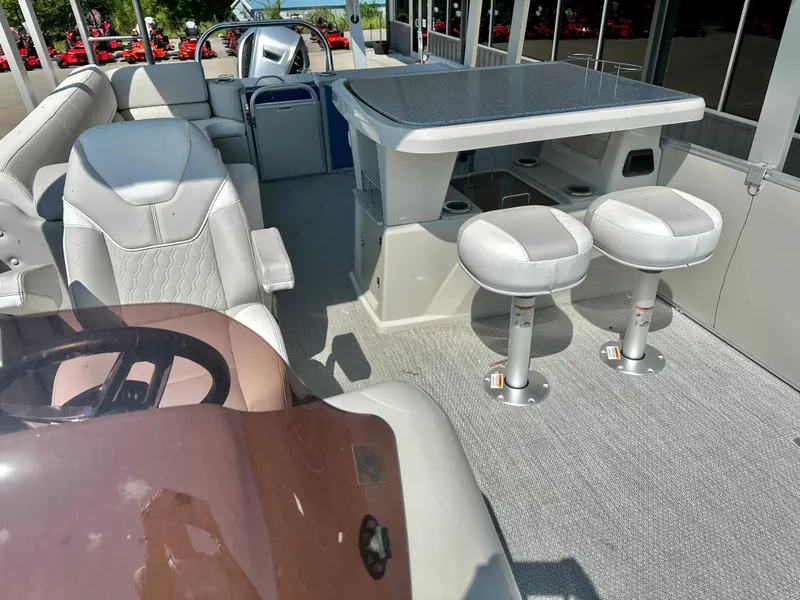 Slide: The Image of 2023 Tahoe Pontoon Cascade Cruise ENT 25 FT Triple 25 WG interior with seating and table. - 8