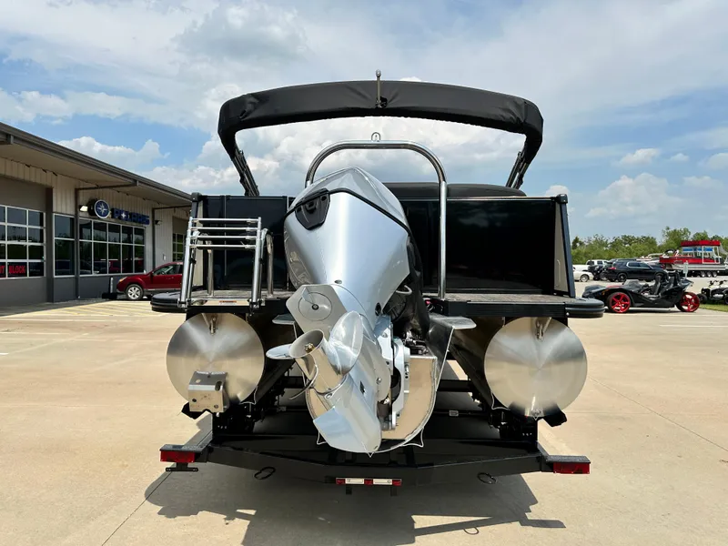 Slide: The Image of 2023 Tahoe Pontoon Cascade Elite 23 FT boat rear view with outboard motor. - 2