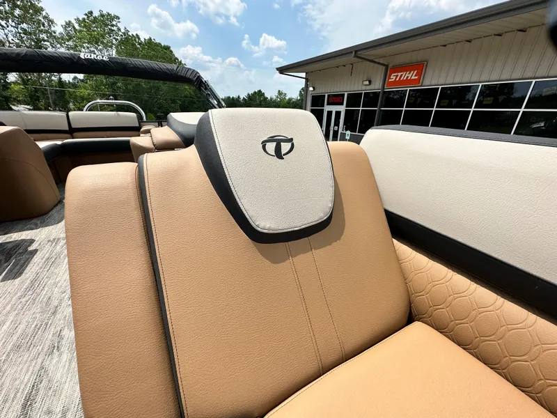 Slide: The Image of 2023 Tahoe Pontoon Cascade Elite 23 FT boat interior with tan and beige seating. - 7