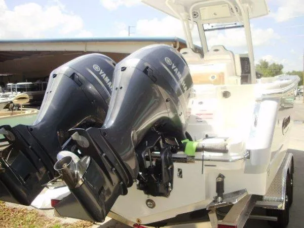 Slide: The Image of 2023 Robalo R250 boat with twin Yamaha outboard engines. - 12