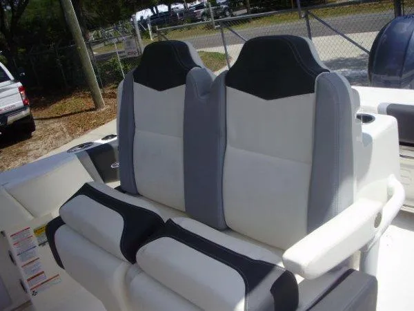 Slide: The Image of 2023 Robalo R250 boat seats with black and white upholstery. - 9
