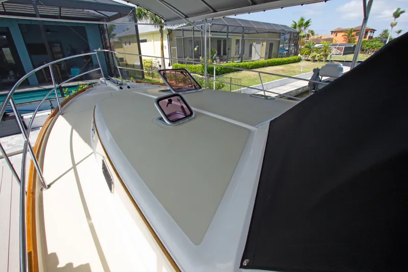 Slide: The Image of 2010 Sabre 40 Hardback Express yacht deck under canopy. - 13