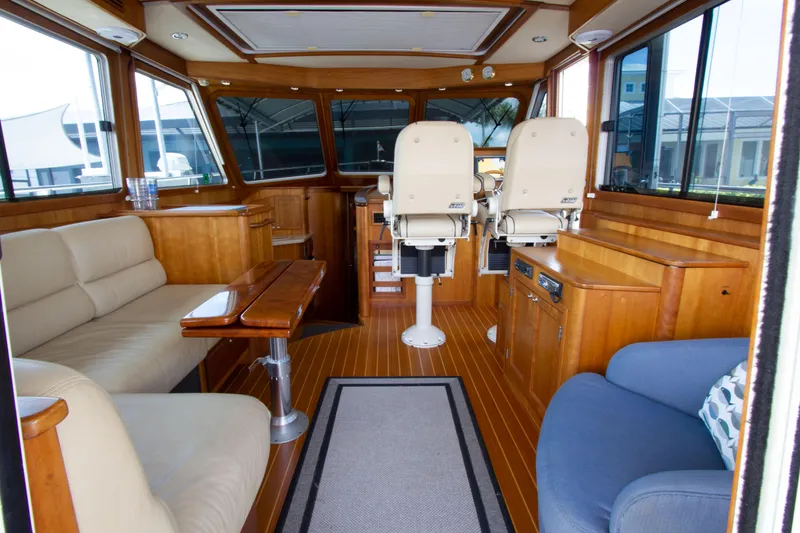 Slide: The Image of Interior of 2010 Sabre 40 Hardback Express yacht with wooden furnishings and seating. - 16