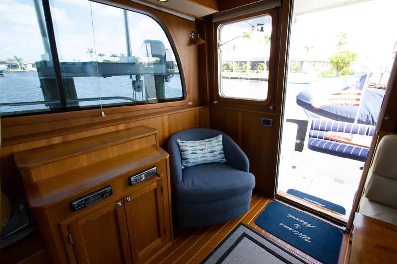 Slide: The Image of Interior of 2010 Sabre 40 Hardback Express yacht with cozy seating area. - 18